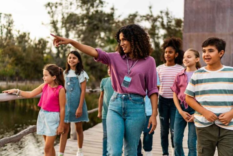 A group of kids and adults enjoy exploring the Detroit Zoo during Veterans Day, celebrating free admission for veterans and active-duty military.