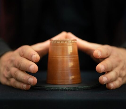 A2 magic show at Ann Arbor Hands On Museum Magician performs a classic cup trick during the A2 magic show at Ann Arbor Hands On Museum as part of a fun family performance