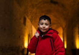 Child explores a tunnel like space during Dig with Spinning Dot Theater at Ann Arbor Hands On Museum, an interactive storytelling performance for kids