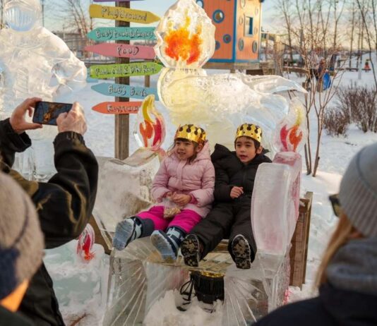 Fire and Ice Festival at Robert C. Valade Park Kids pose on an ice throne at the Fire and Ice Festival at Robert C. Valade Park during family friendly winter fun along the riverfront