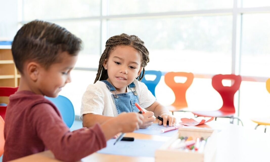 Children in a Macomb County GSRP classroom draw together as free PreK expands and supports early learning for local 4-year-olds.