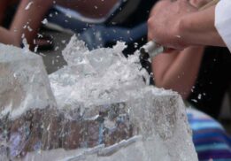 Close up of ice sculpting in progress during Frozen Night at Greenmead Historical Village showing ice chips flying as a block is carved