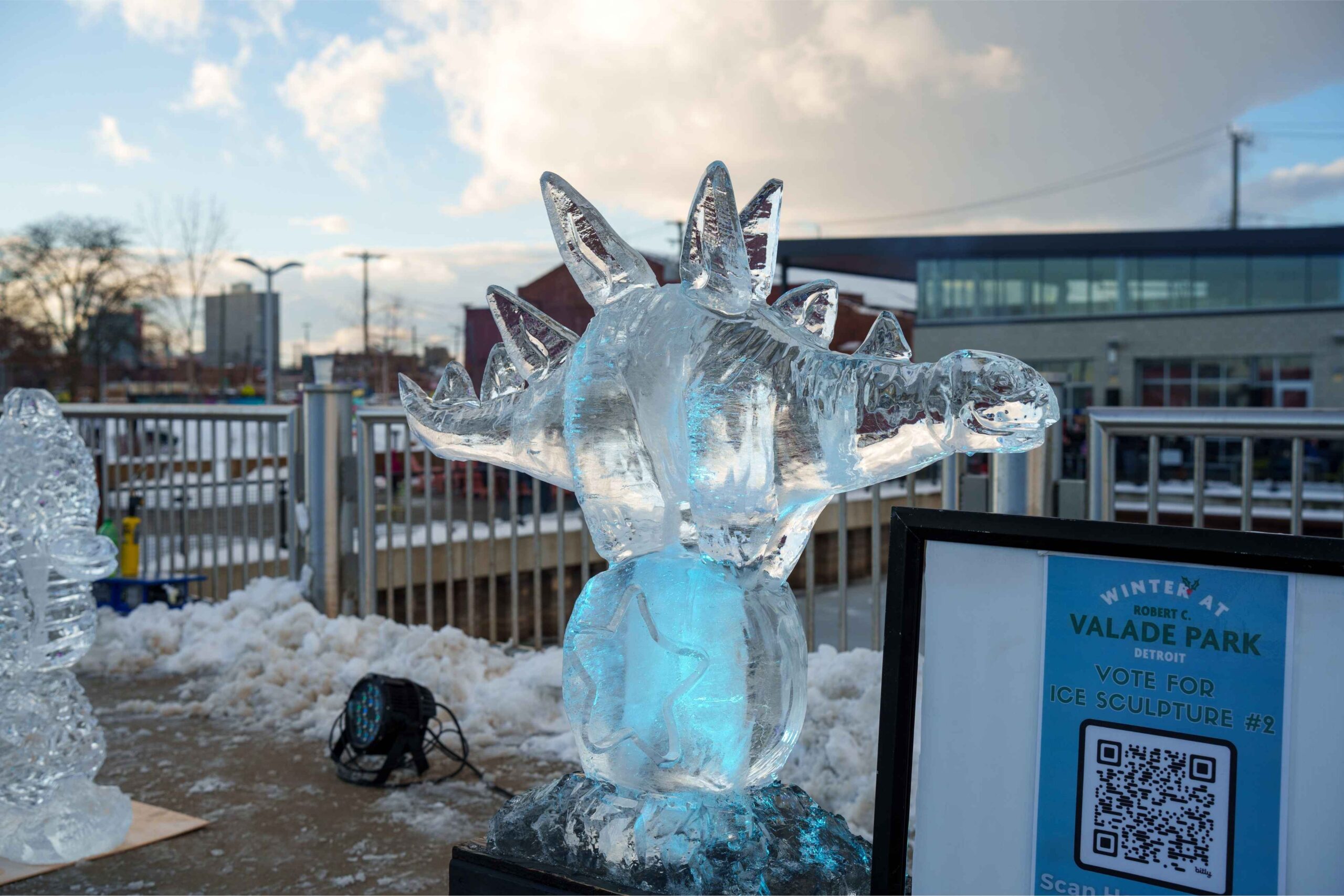 Ice dinosaur sculpture on display during the Hyde Park Art Center MLK Day celebration with free family-friendly art and activities