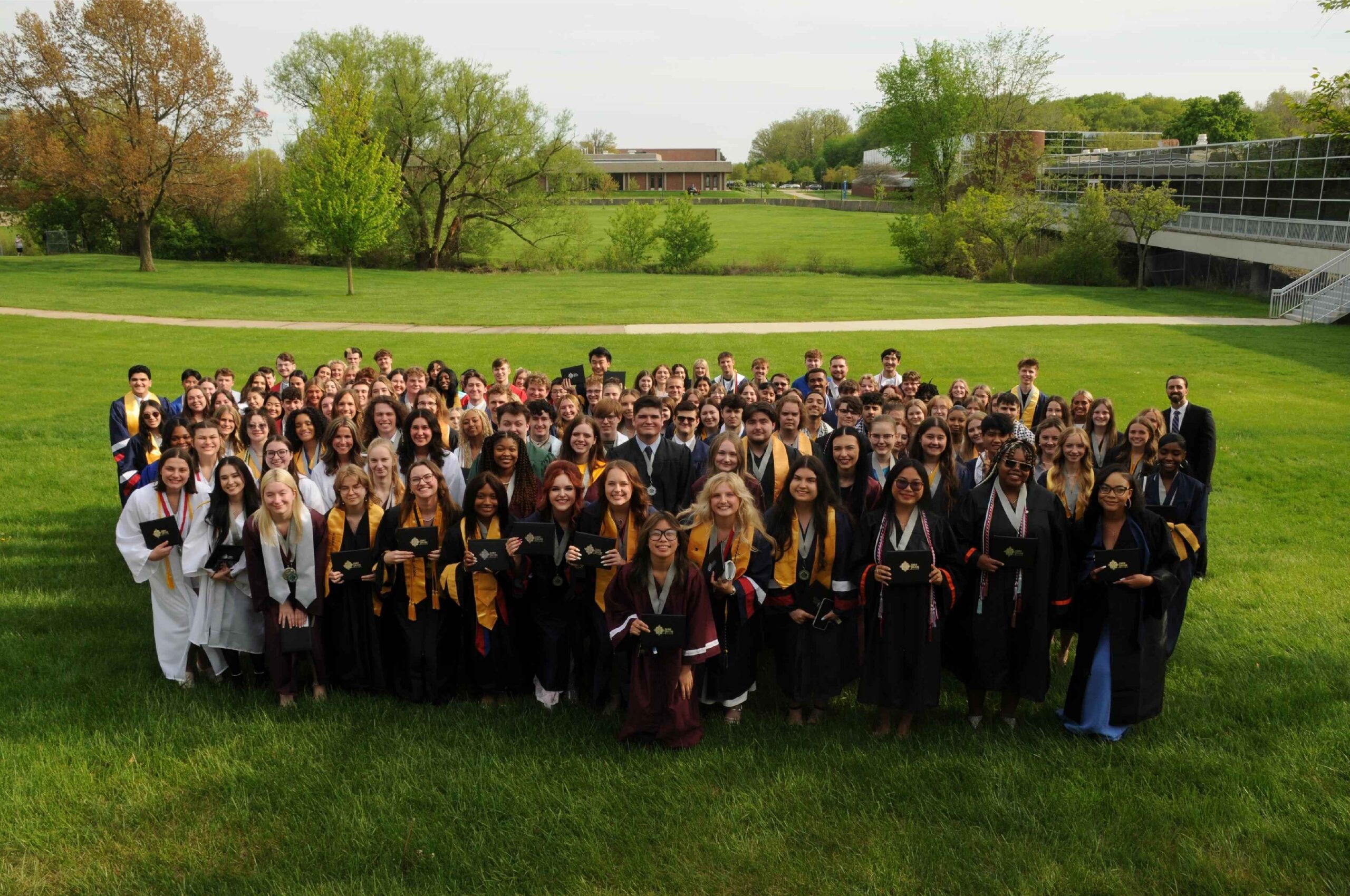 International Academy of Macomb students celebrate graduation together, reflecting the school’s IB rigor, achievement and supportive learning community