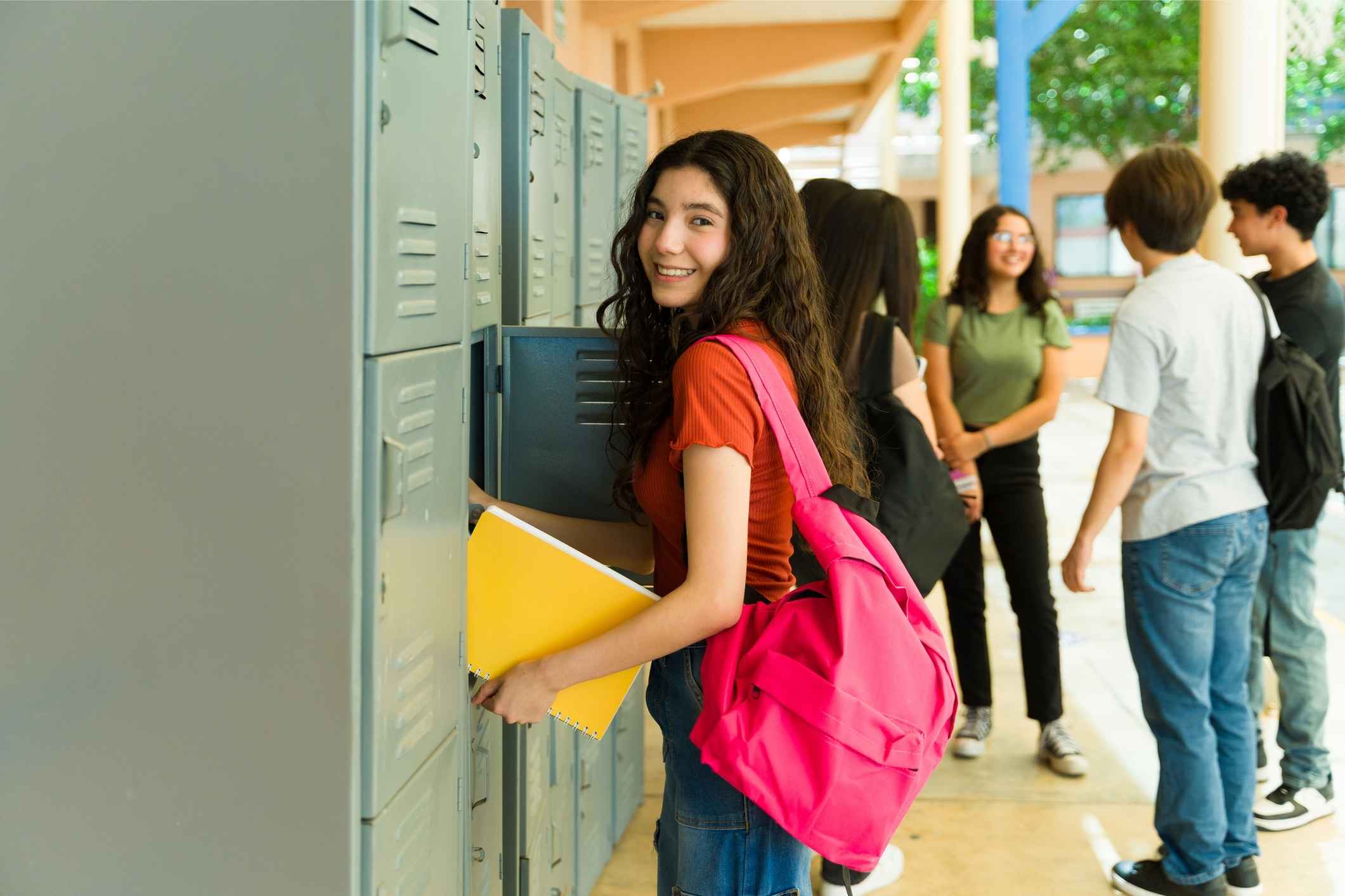 International Academy of Macomb student at school lockers, reflecting a supportive campus culture, peer connection and student belonging