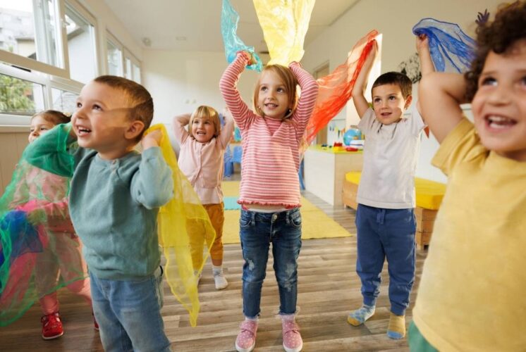 Kids dance and move during the Kara Kaufmann music performance at Ann Arbor Hands On Museum enjoying an interactive show for young children