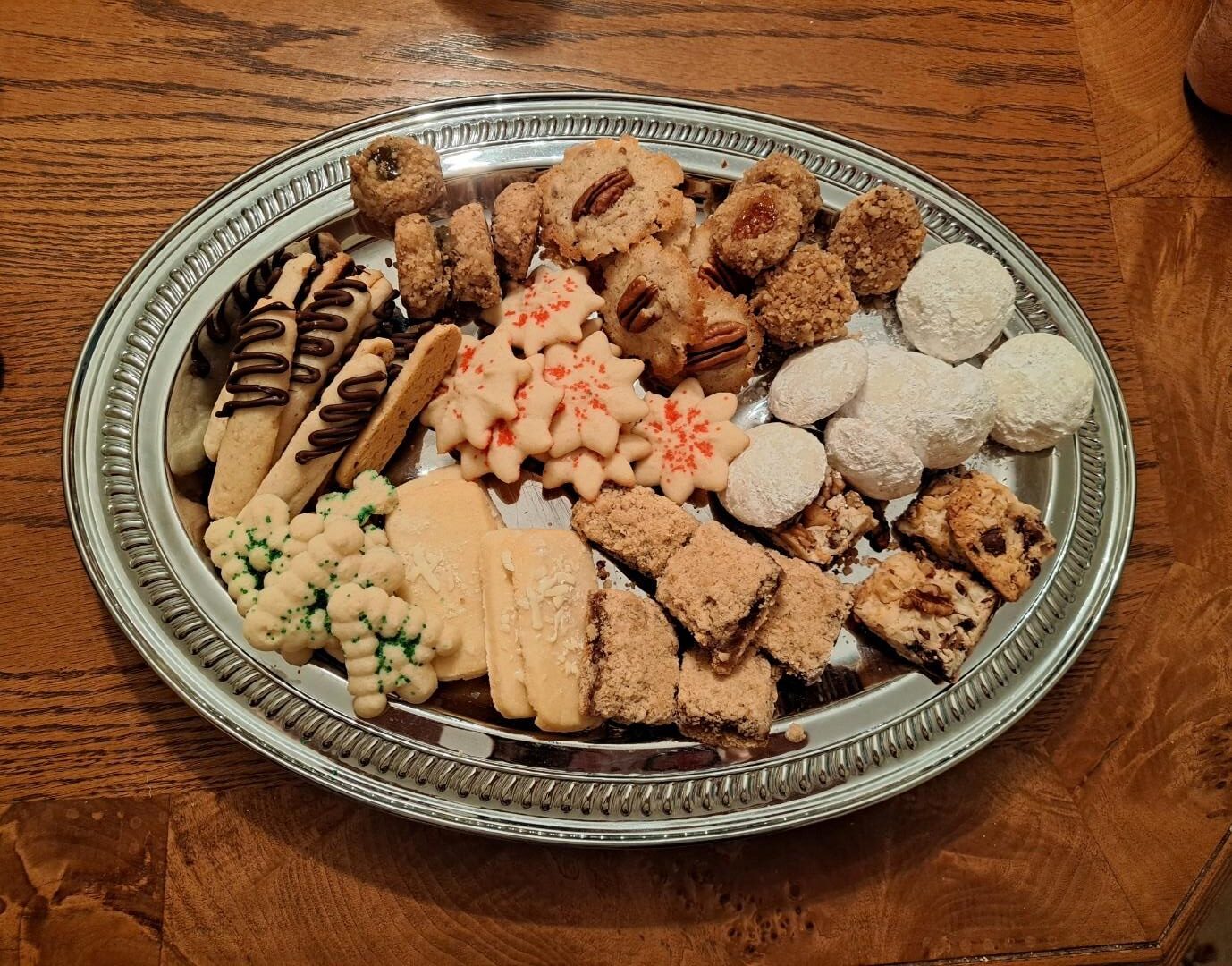 A silver platter filled with an assortment of Mary’s homemade Christmas cookies, part of the Flaga family’s long-standing holiday tradition.