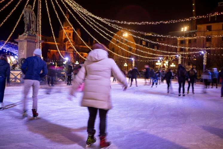 Families enjoy holiday ice skating during Skate with Santa at Dearborn Ice Skating Center with festive lights and winter fun