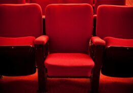 Red theater seats at Michigan Theater for Sun in Ya Hands showing a kid friendly performance atmosphere