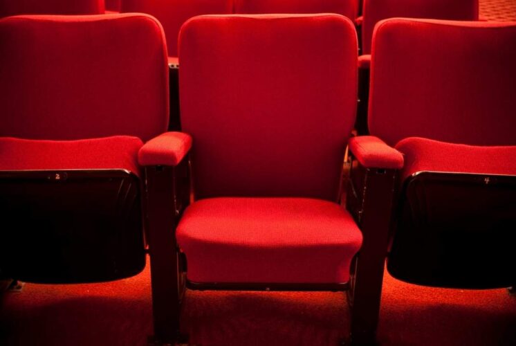 Red theater seats at Michigan Theater for Sun in Ya Hands showing a kid friendly performance atmosphere