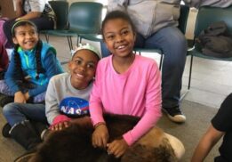 Home school animals in winter nature program showing kids learning about animals up close during a hands on educational experience