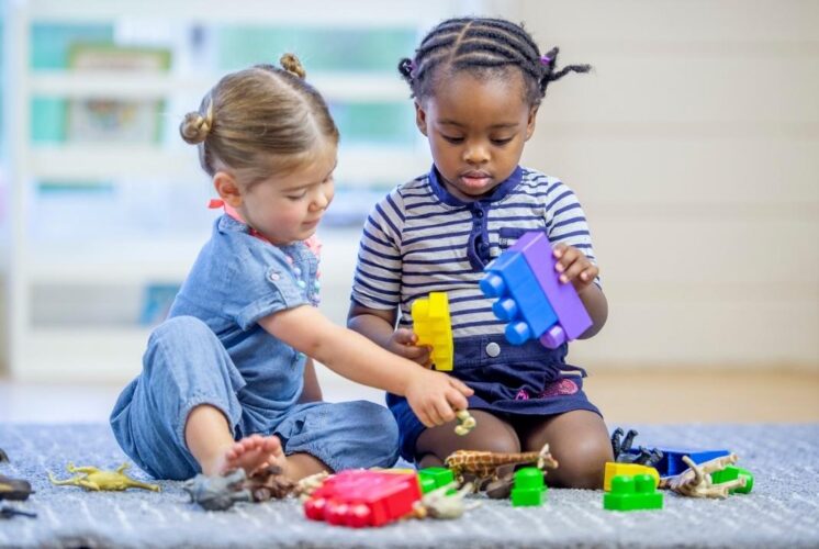 Preschoolers playing and learning together at Morning Munchkins Red Oaks Nature Center during a hands on nature program for young children