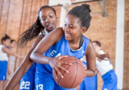 Washtenaw County celebration of girls and women in sports showing girls playing basketball during a youth sports clinic at EMU.