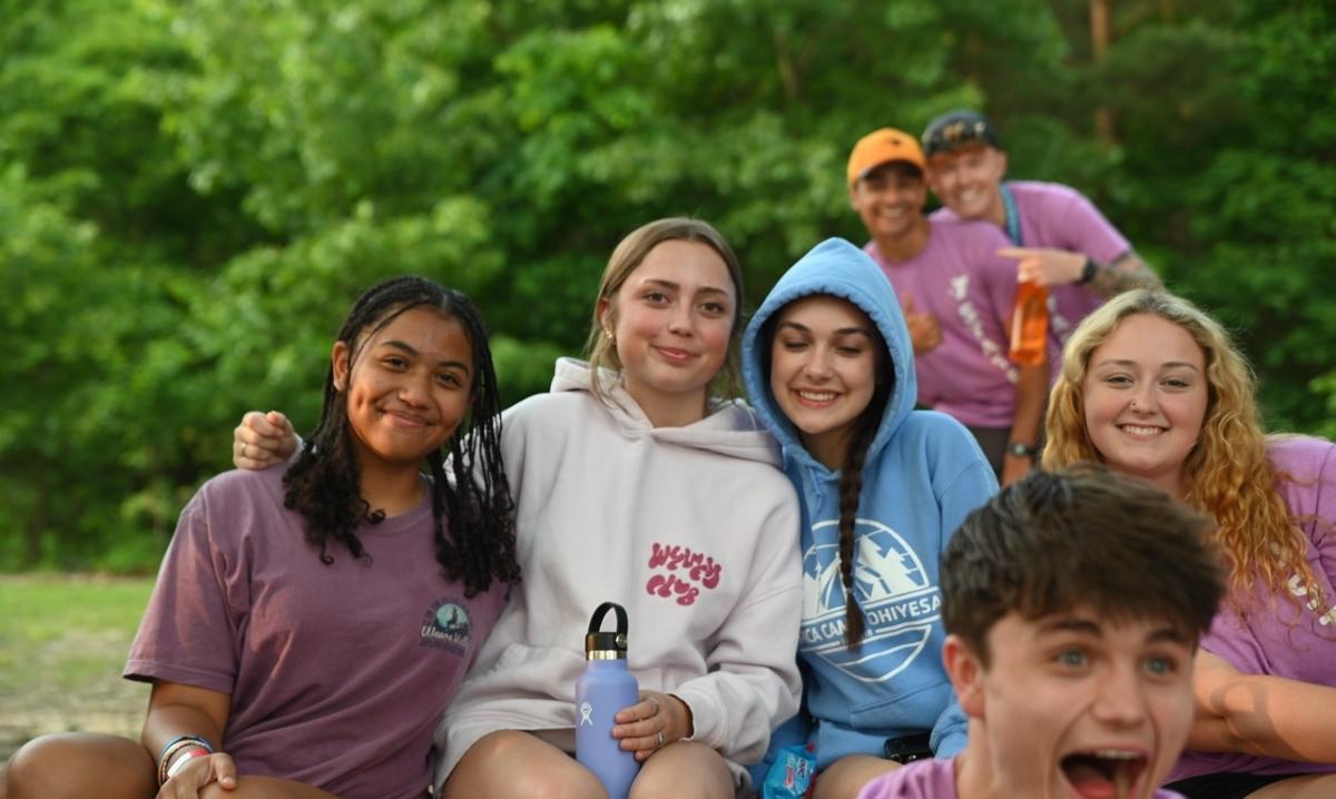Campers smile together at YMCA Camp Ohiyesa in Holly during overnight summer camp activities in Oakland County.