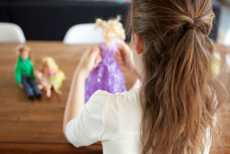 American Girl Tea Party at Saline Recreation with child holding doll in fairy dress ready for crafts and tea party fun