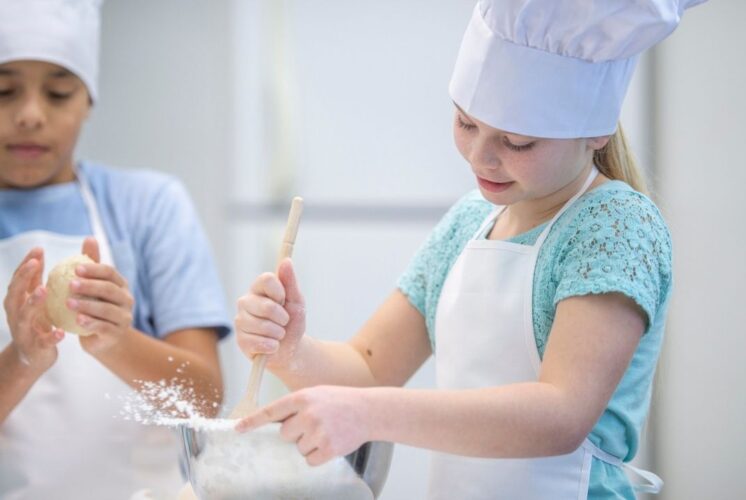 Blakes Jr Bakers Workshop at Blakes Orchard and Cider Mill with kids decorating treats in chef hats during hands on baking fun