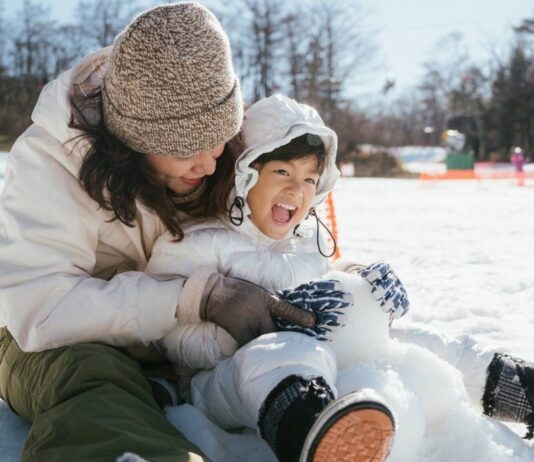 New Baltimore Winterfest at Downtown New Baltimore Family enjoying snow play during Cold Rush at Warren City Square, a free winter festival with outdoor activities, bonfires and fun for kids and parents.