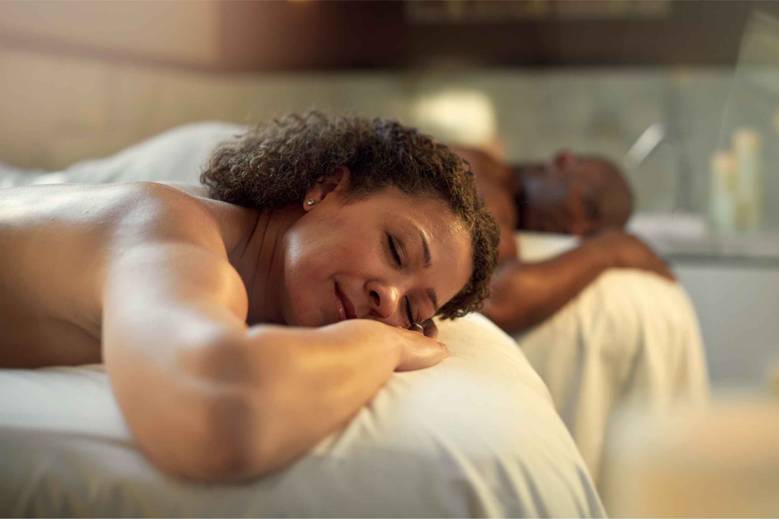 Couple relaxing during a spa treatment at Crystal Mountain in Thompsonville, Michigan on a winter getaway from Metro Detroit.
