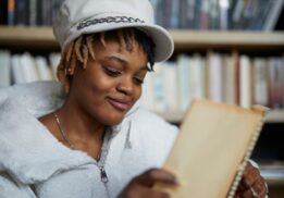 Detroit Youth Poetry Con at Wayne State University with teen writing poetry during creative workshop and open mic event