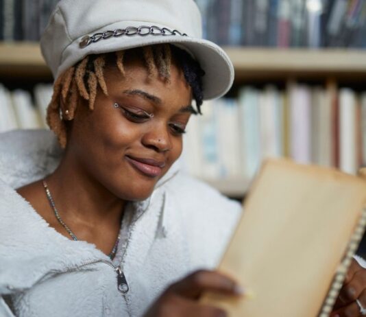 Detroit Youth Poetry Con at Wayne State University Detroit Youth Poetry Con at Wayne State University with teen writing poetry during creative workshop and open mic event