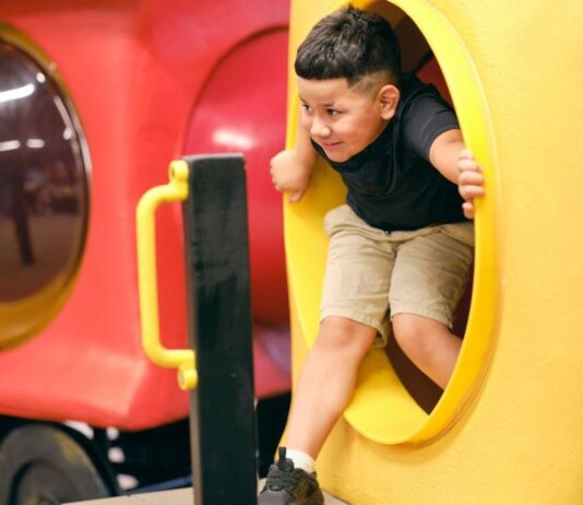 Kids Empire Indoor Playground in Chesterfield Kids Empire Indoor Playground in Chesterfield with child climbing through colorful indoor play structure for all day family fun