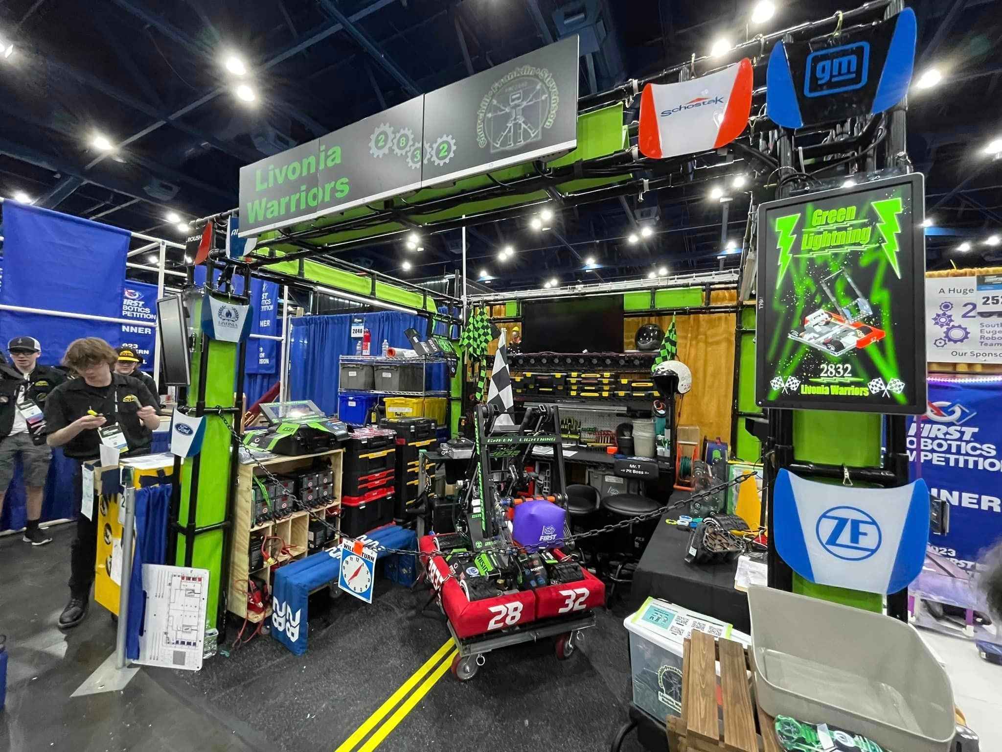Livonia Public Schools FIRST Robotics team pit at competition, showcasing student engineering, teamwork and STEM innovation.