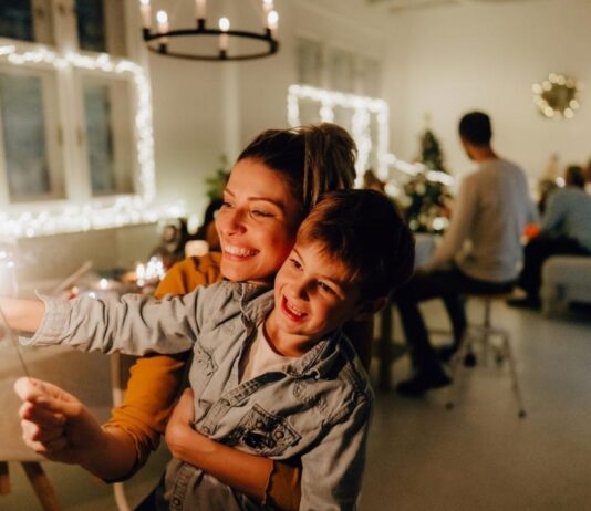 Mother Son Date Night at Heritage Hall with mom and son enjoying a festive evening together under twinkling lights