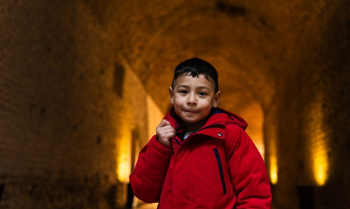 Mystery of the Mayan Medallion immersive exhibit showing a child exploring ancient ruins during a hands on museum adventure.