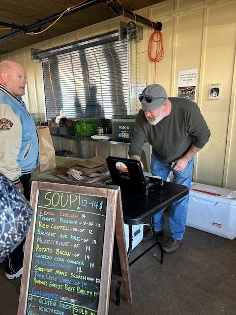 Local soup stand in Northern Michigan during a winter road trip to Gaylord with homemade soups and small town charm.
