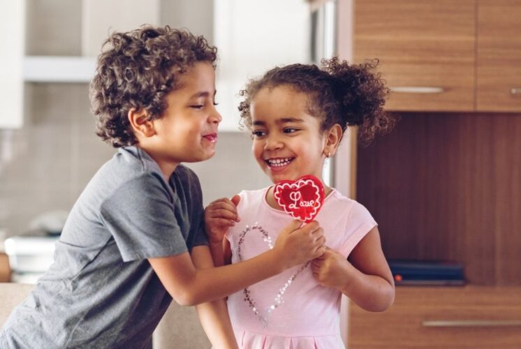 Wasem’s Winter Pop Up Valentine’s Day moment with kids sharing a heart shaped treat, highlighting family friendly donuts and sweets.