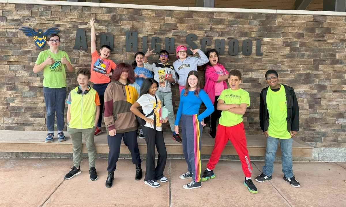Students pose outside Aim High School in Farmington Hills, a private school for grades 6–12 serving kids with learning differences
