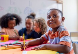 Artist trading cards workshop at Detroit Institute of Arts with kids creating colorful mini art projects in hands on art making session