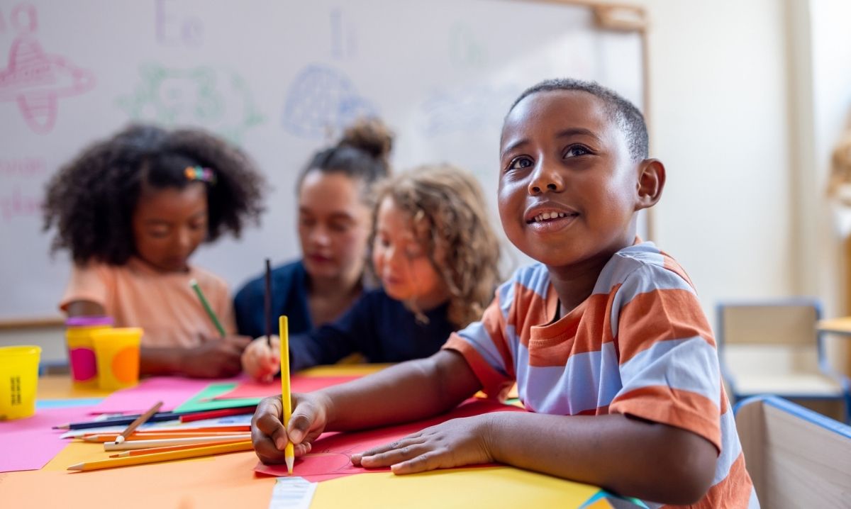 Artist trading cards workshop at Detroit Institute of Arts with kids creating colorful mini art projects in hands on art making session