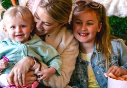 Family with kids enjoying Blake’s Backyard Almont Easter egg hunt event with spring activities bunny fun and family photo moments