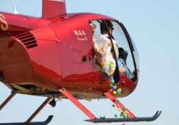 Canterbury Village helicopter egg drop with colorful eggs falling from helicopter for kids Easter event and egg hunt fun