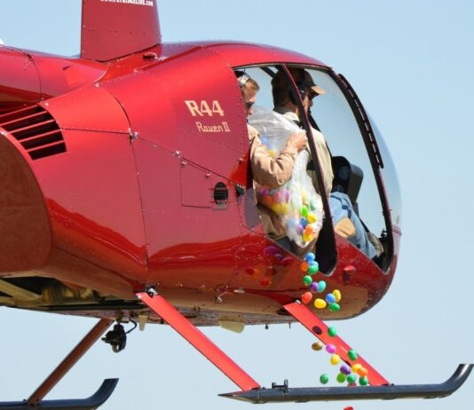 Canterbury village helicopter egg drop at Canterbury Village Canterbury Village helicopter egg drop with colorful eggs falling from helicopter for kids Easter event and egg hunt fun