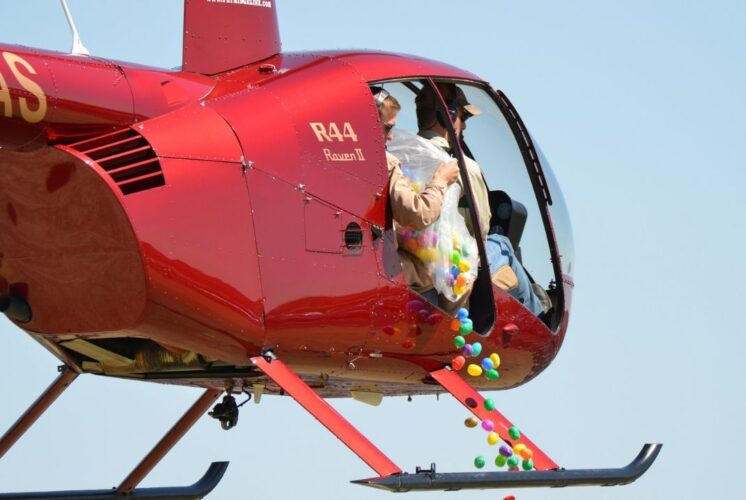 Canterbury Village helicopter egg drop with colorful eggs falling from helicopter for kids Easter event and egg hunt fun
