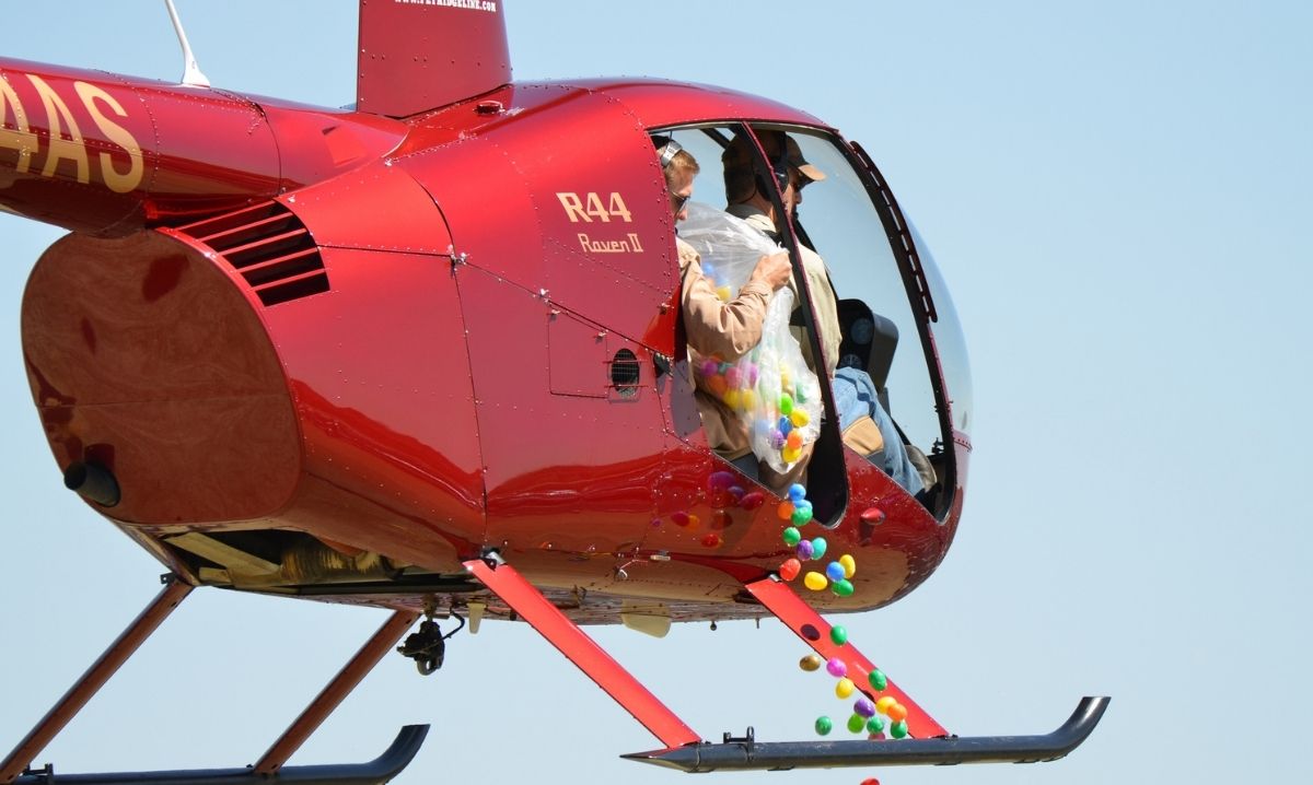 Canterbury Village helicopter egg drop with colorful eggs falling from helicopter for kids Easter event and egg hunt fun
