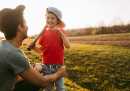 Downtown Detroit Tigers Takeover at Nick Gilbert Way with child holding baseball bat enjoying family friendly baseball fun outdoors