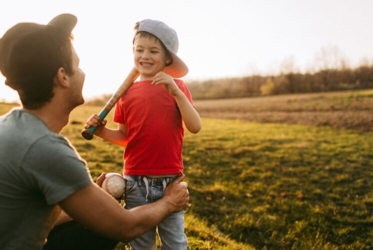 Downtown Detroit Tigers Takeover at Nick Gilbert Way with child holding baseball bat enjoying family friendly baseball fun outdoors
