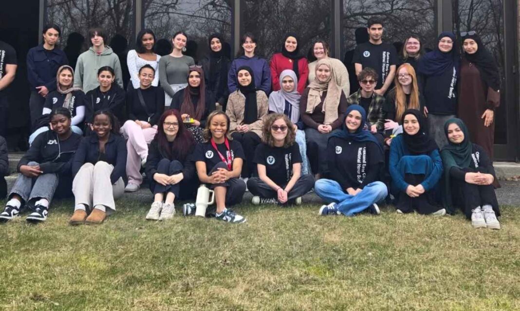 Students at Oakland Early College gather on campus, highlighting a supportive Early Middle College community and college ready environment