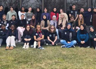 Students at Oakland Early College gather on campus, highlighting a supportive Early Middle College community and college ready environment