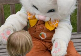Easter Bunny photos at The Village of Rochester Hills with child meeting Easter Bunny for spring family event and festive fun