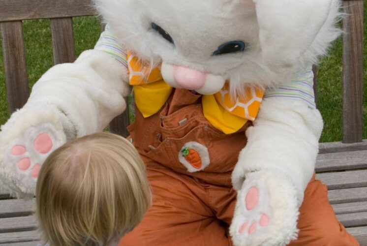 Easter Bunny photos at The Village of Rochester Hills with child meeting Easter Bunny for spring family event and festive fun