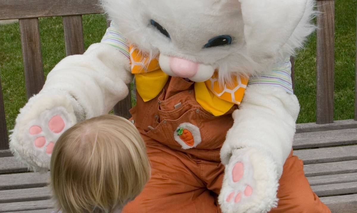 Easter Bunny photos at The Village of Rochester Hills with child meeting Easter Bunny for spring family event and festive fun