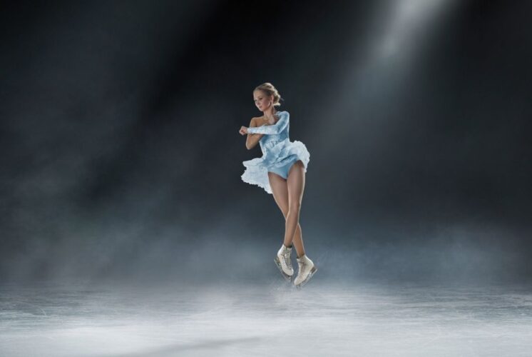 Young figure skater performs jump on ice at Novi Ice Arena representing Emilea Zingas and Vadym Kolesnik meet and greet event exhibition performance