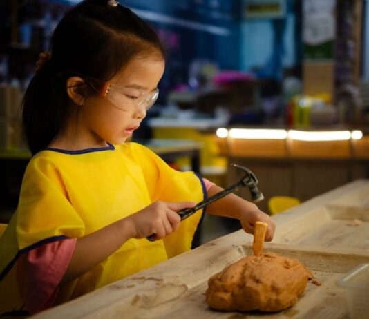 Family Day: Children and Play in the Ancient World Child participates in hands-on archaeology craft during Family Day Children and Play in the Ancient World at the Kelsey Museum of Archaeology