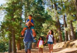 Family hike at Hudson Mills Metropark with kids and parents walking scenic nature trail and exploring outdoors together