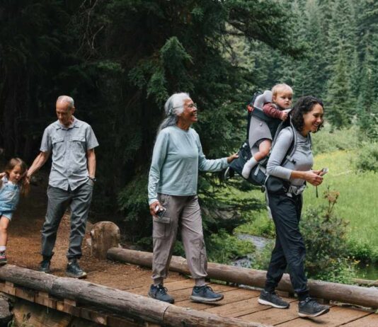 Family Nature Adventure Over and Under the Pond at Belle Isle Nature Center Family nature adventure over and under the pond at Belle Isle Nature Center with families walking on a wooded trail exploring nature together
