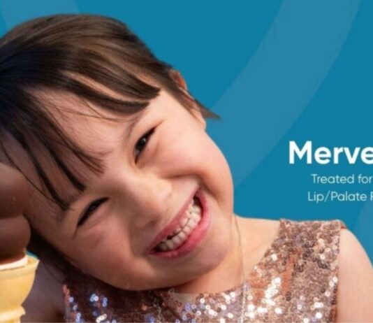 Free Cone Day at Dairy Queen West Bloomfield image of a child holding an ice cream cone for the spring giveaway event.